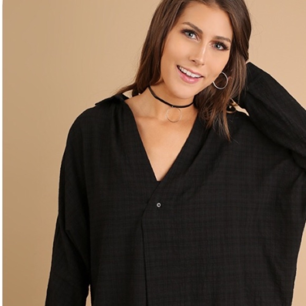 Black plaid RELAXED over sized top.
